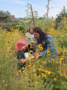 FoodCorps rep Adrienne helping kids in the garden