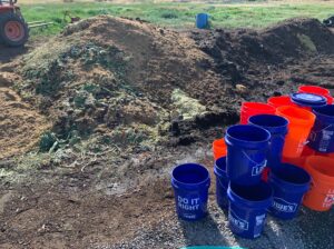 5-gallon buckets next to a mound of trube at Fields Farm