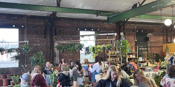 People at an indoor clothing swap