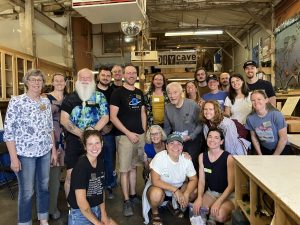 group of 20 staff and volunteers smiling