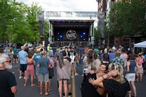 Photo at Bend SummerFeset with lots of people in front of a stage