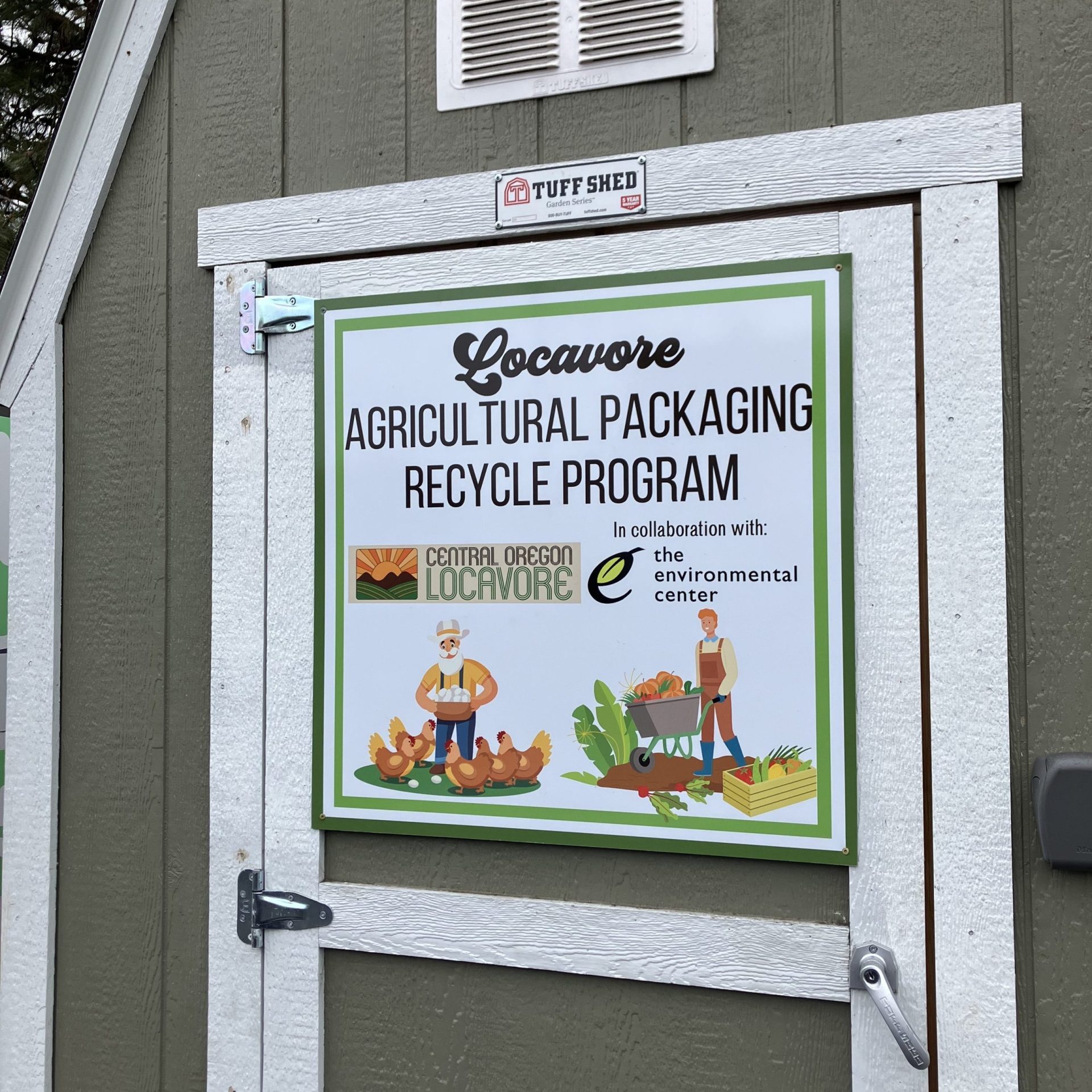 A storage shed with a sign that reads: "Locavore Agricultural Packaging Recycle Program in collaboration with The Environmental Center"